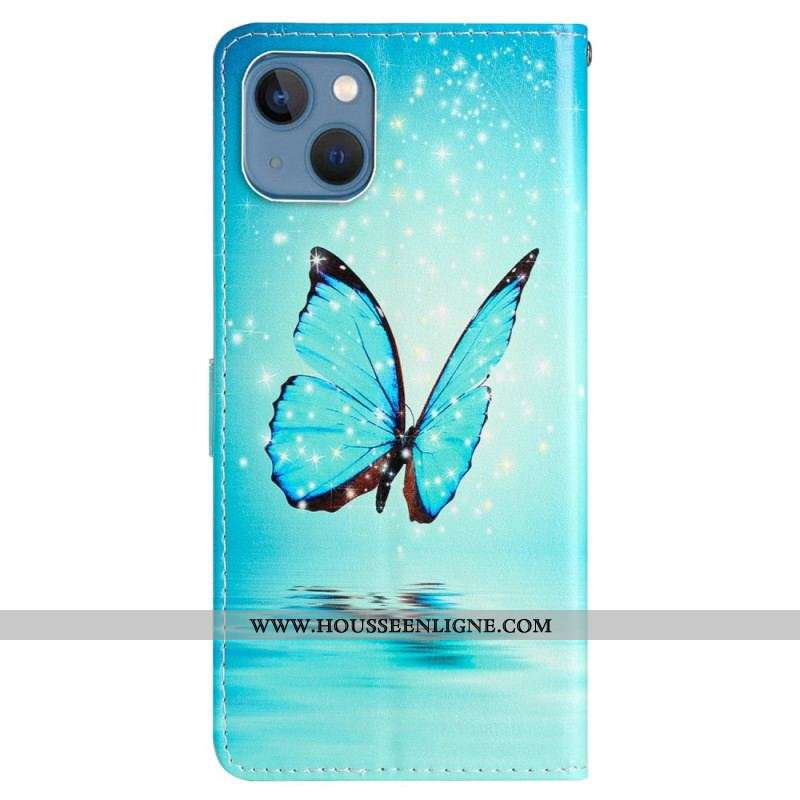 Housse iPhone 15 Papillon Bleu en Vol à Lanière