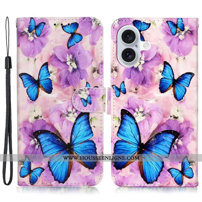 Housse iPhone 16 Papillons Bleus et Fleurs Violettes à Lanière