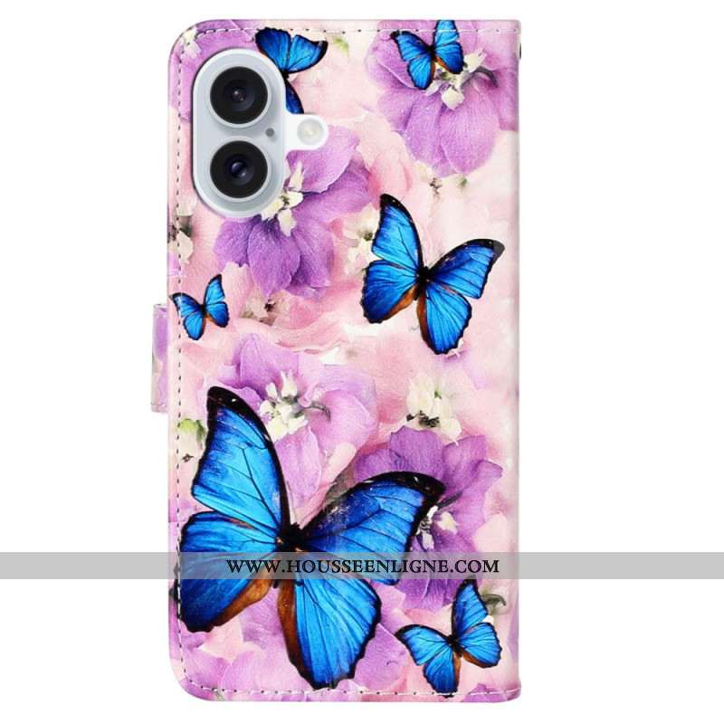 Housse iPhone 16 Papillons Bleus et Fleurs Violettes à Lanière